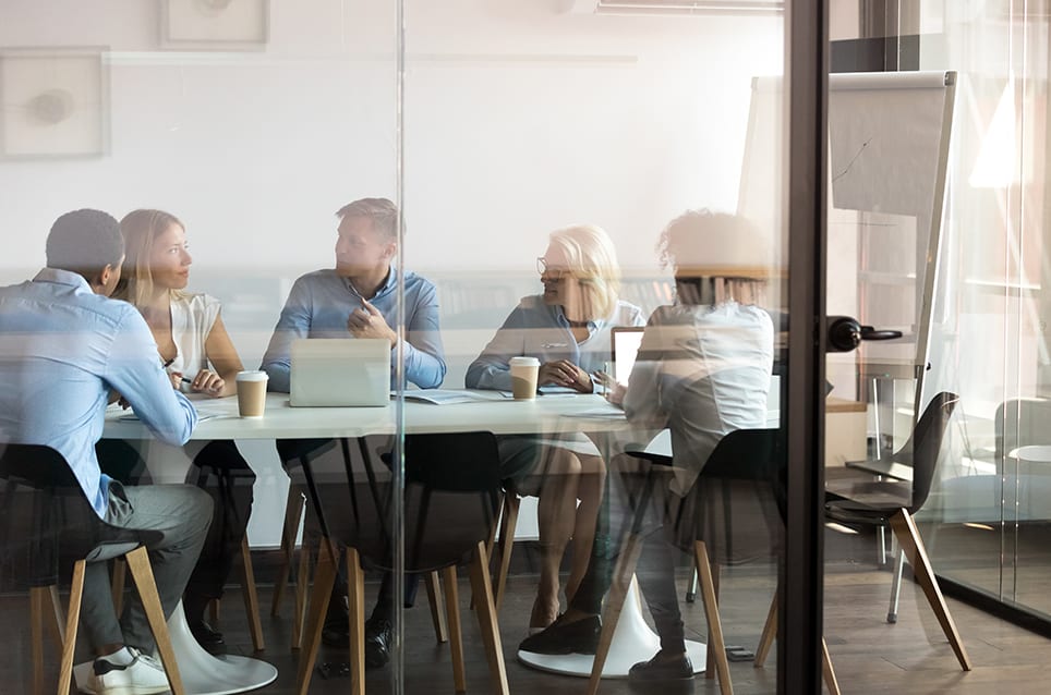 department-brainstorming-at-modern-office-boardroom-behind-closed-doors department brainstorming at modern office boardroom behind closed doors
